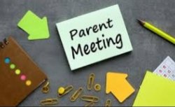 Parent Meeting sign on a desk with pencil and pad